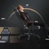 A man is shown relaxing in a gaming chair, demonstrating its reclining feature with angle indicators. Produktbild-Vorschau