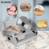 A Bomann slicer is shown with various food items sliced, including ham, sausage, bread, and cheese, presented in circular insets around the main product image. Produktbild-Vorschau