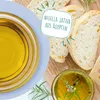 A close-up of bread slices and bowls of oil, with text overlay. Produktbild-Vorschau
