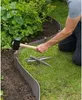 A person is installing garden edging with a mallet. Produktbild-Vorschau