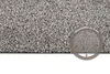 Close-up view of a textured doormat with a circular overlay indicating its thickness. Anteprima dell’immagine prodotto