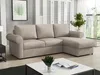 A modern living room with a sectional sofa, coffee table, and decorative elements. Náhled obrázku produktu