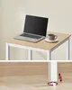 A small table with a laptop and a cup of coffee on it, shown from two angles. Produktbild-Vorschau