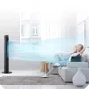 A woman relaxing on a couch in a bright living room, with a tower fan blowing air towards her. Náhled obrázku produktu