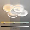 A modern LED ceiling light with multiple rings, shown with a color temperature and brightness scale. Voir les images du produit