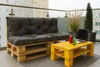 A balcony with a pallet sofa and coffee table set up for outdoor relaxation. Produktbild-Vorschau