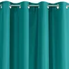 A close-up view of teal curtains with grommets. Produktbild-Vorschau