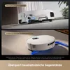A split image showing a robot vacuum cleaner demonstrating its ability to navigate over long-pile carpets and around chair legs. Produktbild-Vorschau