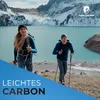 Two people hiking in a mountainous landscape with a lake in the background. Produktbild-Vorschau