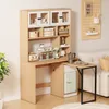 A compact desk with integrated shelving and a small refrigerator, set up in a living space next to a sofa. Náhled obrázku produktu