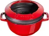 A red cast iron fondue pot with a black insert and a red lid with the words "LA FONDUE" embossed on it. Voir les images du produit