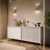 A modern living room with a beige sideboard, decorative items, and ambient lighting. Produktbild-Vorschau