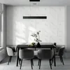 A dining room setting with a table and chairs, featuring a marble-look wall. Produktbild-Vorschau