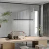 A modern dining room with a long wooden table, a pendant light, and decorative items. Produktbild-Vorschau