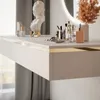 A close-up of a modern, floating makeup vanity with various cosmetic products arranged on its surface. Produktbild-Vorschau