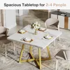 A dining table set in a modern dining room with chairs and a sideboard in the background. Produktbild-Vorschau