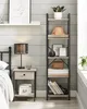 A bedroom scene featuring a VASAGLE bookshelf next to a nightstand and bed. Náhľad obrázku produktu