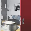 A modern living room with a sofa, coffee table, and a red sliding door partially open. Produktbild-Vorschau