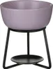 A lilac-colored ceramic bowl sits on a black metal stand with a black base. Produktbild-Vorschau
