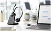 A headset and its charging station are placed on a desk next to a laptop. Produktbild-Vorschau