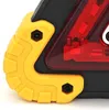 A close-up view of the corner of a triangular warning light with yellow protective bumpers and a red LED light. Voir les images du produit