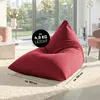 A red beanbag chair is shown in a living room setting with a large window in the background. Voir les images du produit