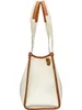 A side view of a white tote bag with brown trim and handles. Anteprima dell’immagine prodotto