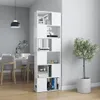 A white bookshelf room divider is shown in a room with a dining table and chairs in the background. Náhľad obrázku produktu