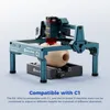 A laser engraving machine with a rotating attachment is shown engraving a spherical object. Produktbild-Vorschau