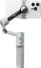 A white smartphone is mounted on a gray gimbal stabilizer, shown against a white background. Podgląd zdjęcia produktu