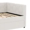 Close-up view of a white upholstered bed frame with a slatted base. Náhled obrázku produktu
