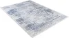 A rectangular rug with a distressed pattern in blue and white is shown from a diagonal angle on a white background. Produktbild-Vorschau
