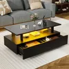 A modern black coffee table with hidden storage and LED lighting, placed on a rug in a living room.