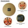 A collage of images showing details of a wall clock with a fox design, including the front, back, and clock mechanism. Produktbild-Vorschau