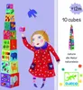 A girl is building a tower of colorful blocks with animal and number illustrations. A blue bird flies in the background. Text and a logo are present on the right side. Anteprima dell’immagine prodotto