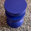 A blue stool on a speckled floor. Anteprima dell’immagine prodotto