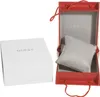 A white Guess watch box and an open red Guess gift box with a watch pillow. Produktbild-Vorschau