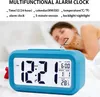 A person sleeping in bed with a blue alarm clock in the foreground. Náhled obrázku produktu