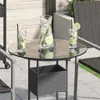 A round glass tabletop with two glasses of iced drinks and a pitcher of iced drinks on a patio. Náhled obrázku produktu