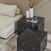 Two square coffee tables with a marble look are placed next to a sofa in a living room setting. Anteprima dell’immagine prodotto