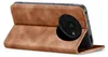 A brown flip case for a smartphone is shown open, revealing the back of the phone with its camera module. Produktbild-Vorschau
