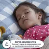 A young girl sleeping in bed with stuffed animals. Podgląd zdjęcia produktu