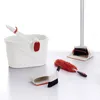 A collection of cleaning tools, including a bucket, dustpan, broom, and dust wand, arranged on a white surface. Anteprima dell’immagine prodotto