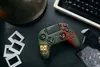 A Call of Duty themed gaming controller is laid out on a dark surface with other vintage items. Produktbild-Vorschau