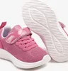A pair of pink children's sneakers shown from a diagonal angle, with one shoe in focus and the other slightly behind and to the side. The sole of the shoe is visible. Podgląd zdjęcia produktu