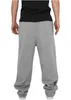 Back view of a person wearing grey sweatpants. Produktbild-Vorschau