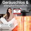 A woman is sitting on a couch next to a heater, with promotional text and a test seal. Produktbild-Vorschau
