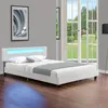 A modern white bed with blue LED lighting in a bedroom setting. Náhled obrázku produktu