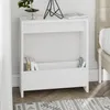 A white bedside table with books and magazines on it, next to a bed. Anteprima dell’immagine prodotto