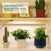 Indoor plants on shelves with a grow light. Náhľad obrázku produktu